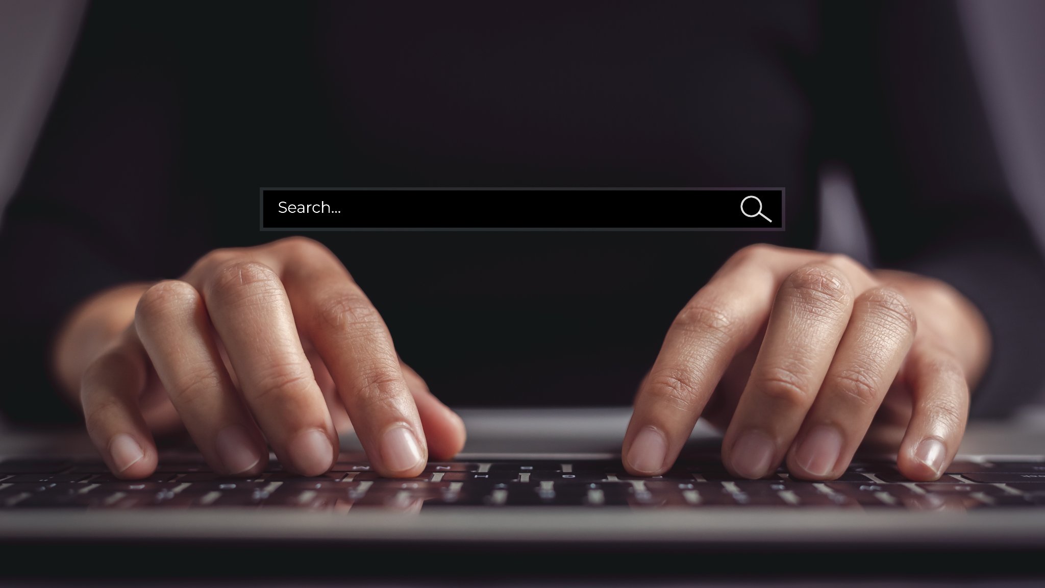 Person typing on laptop with search bar visible — local SEO and Google visibility